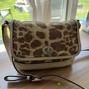 Cream colored giraffe print crossbody Coach bag